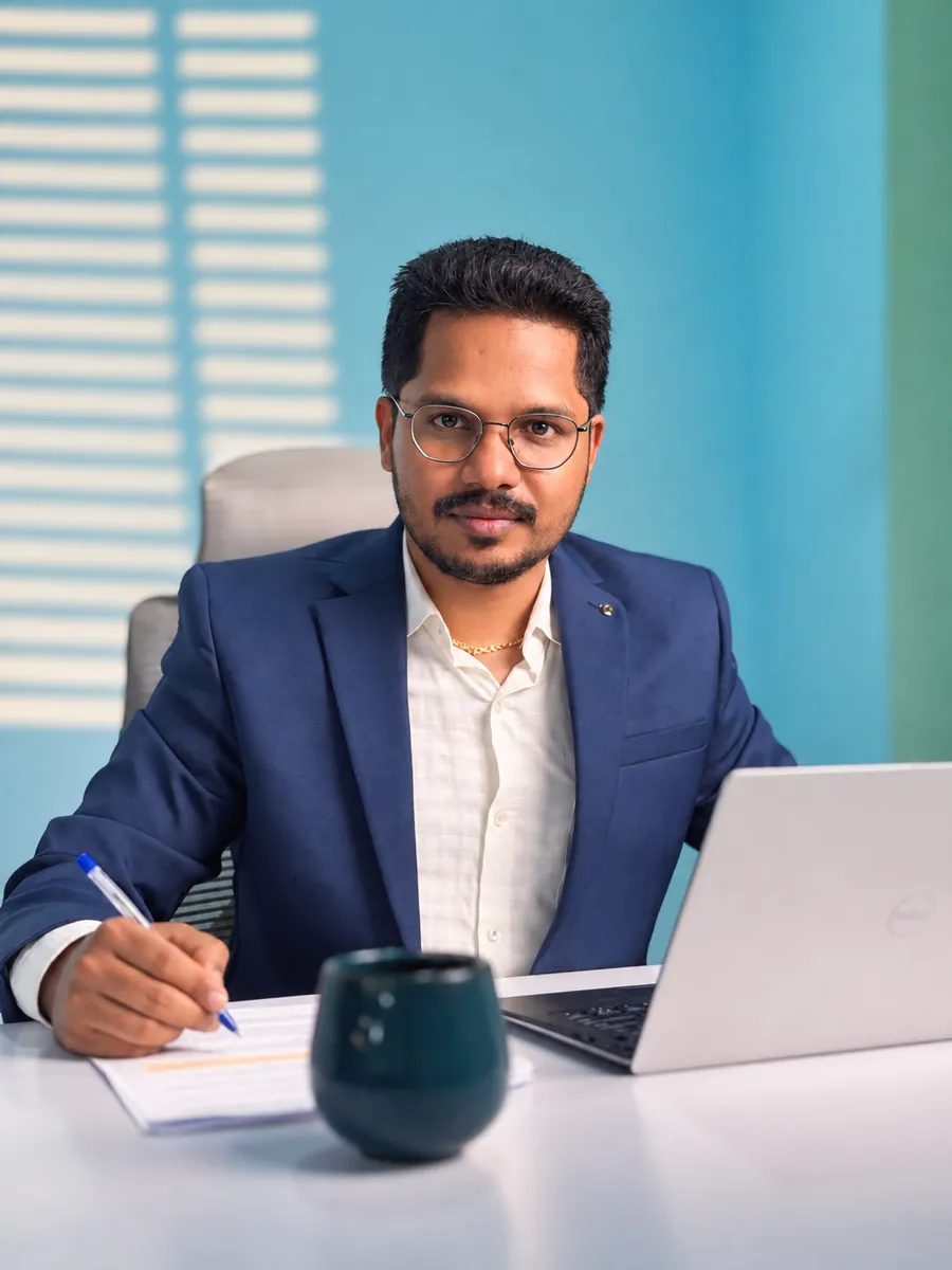 Logeshwaran, Founder of Lydon Group, at his desk
